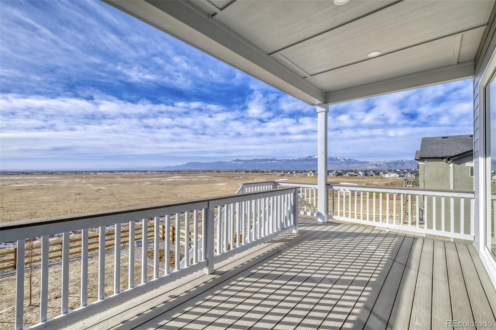 9659 Owl Perch Loop Colorado Springs, CO 80908 - Photo 14 of 28 a view of a balcony with wooden floor