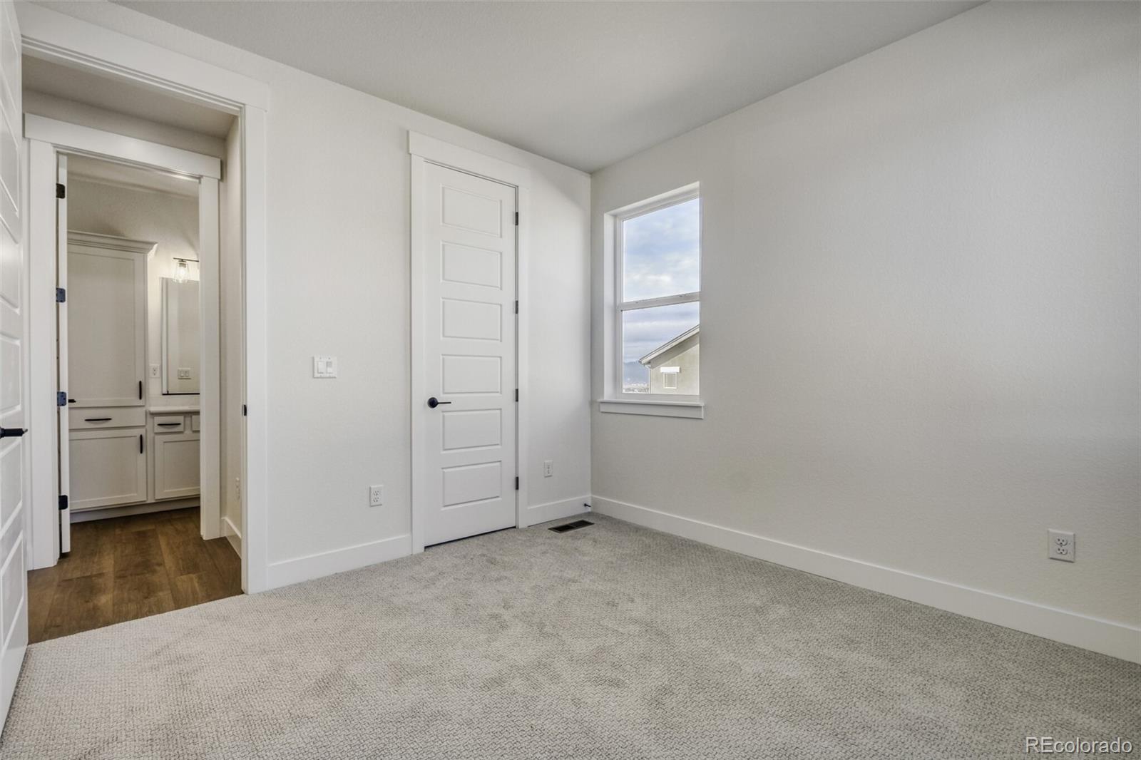 9659 Owl Perch Loop Colorado Springs, CO 80908 - Photo 15 of 28 wooden floor and cabinet in a room
