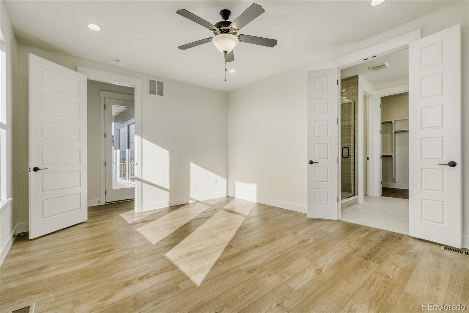 9659 Owl Perch Loop Colorado Springs, CO 80908 - Photo 18 of 28 a view of a livingroom with a ceiling fan & entryway