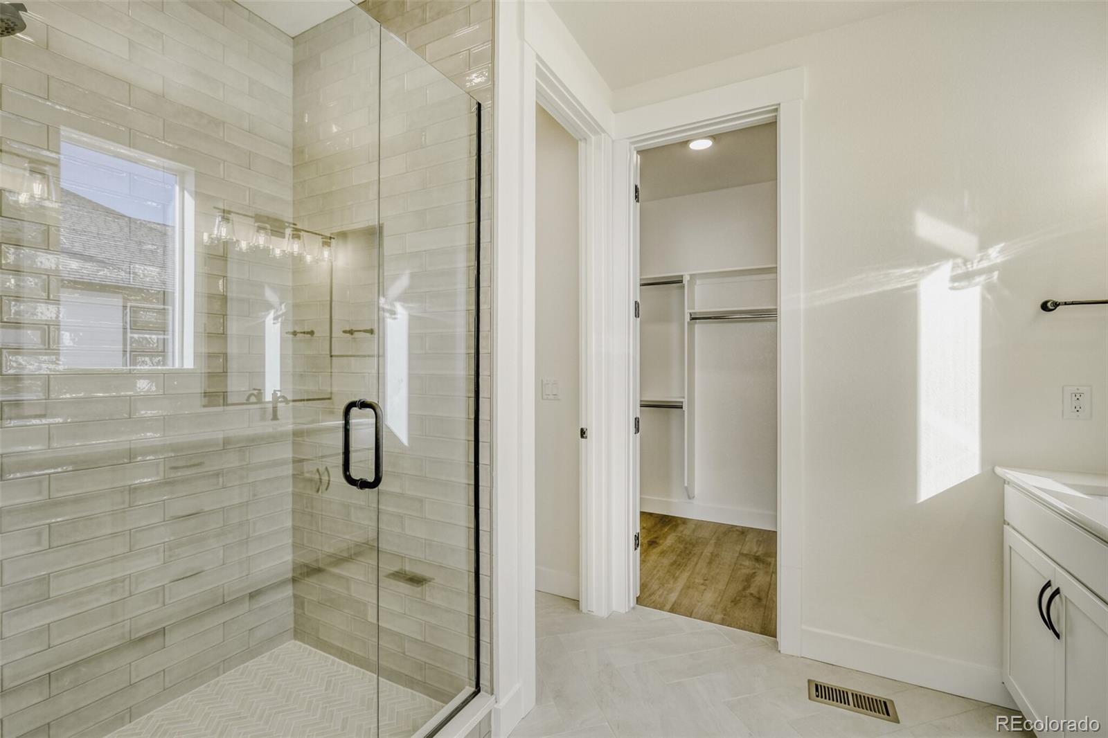 9659 Owl Perch Loop Colorado Springs, CO 80908 - Photo 23 of 28 a bathroom with a shower