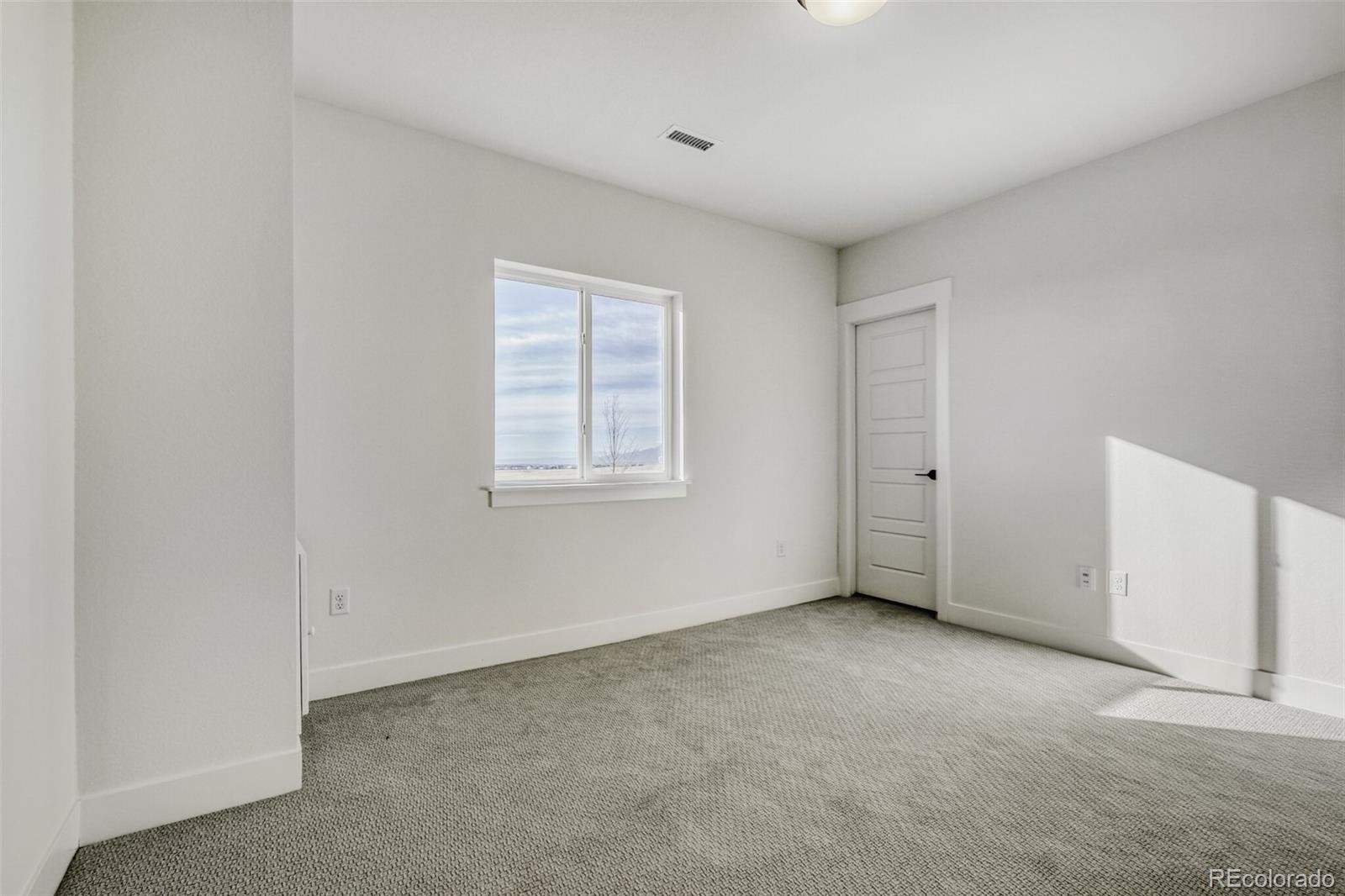 9659 Owl Perch Loop Colorado Springs, CO 80908 - Photo 26 of 28 an empty room with windows