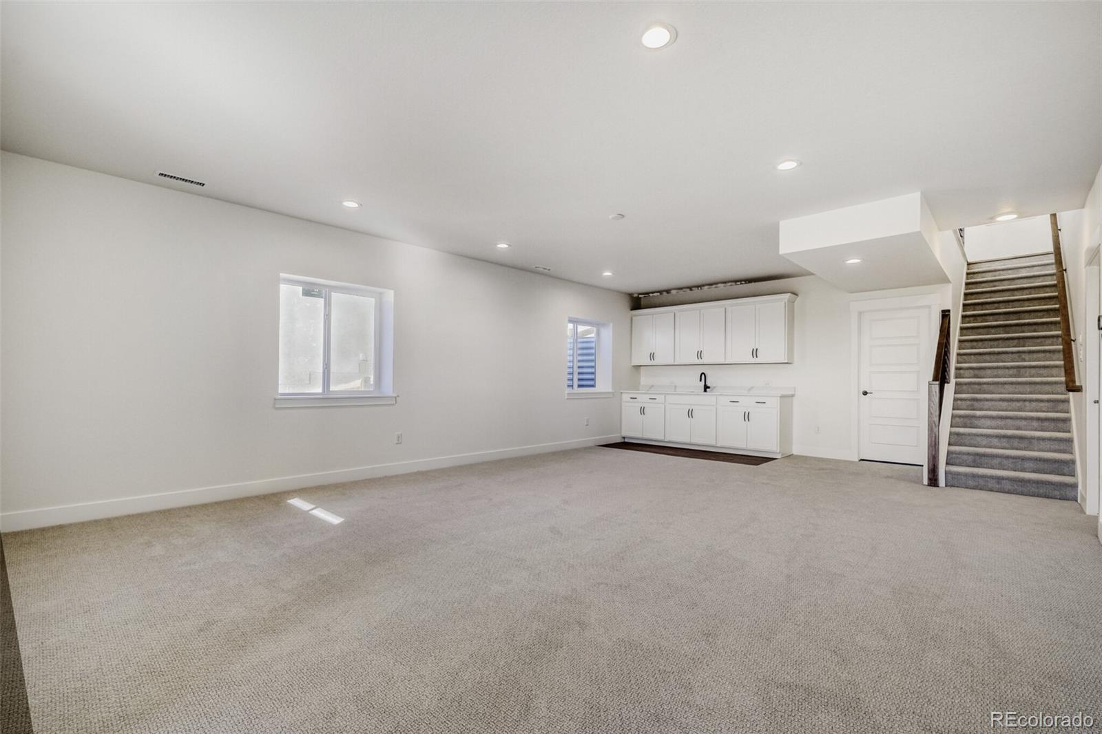 9659 Owl Perch Loop Colorado Springs, CO 80908 - Photo 3 of 28 an empty room with a window and a fireplace