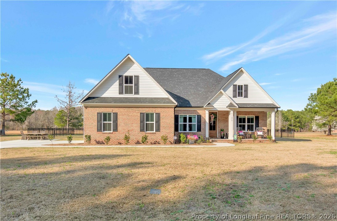 570 Old Tower Road Lumberton, NC 28360 - Photo 1 of 32 a front view of a house with a outdoor space