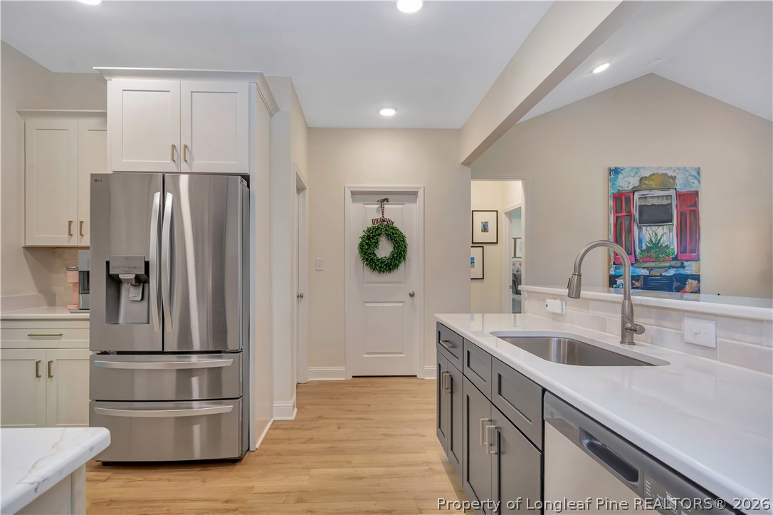 570 Old Tower Road Lumberton, NC 28360 - Photo 16 of 32 a kitchen with stainless steel appliances granite countertop a refrigerator and a sink