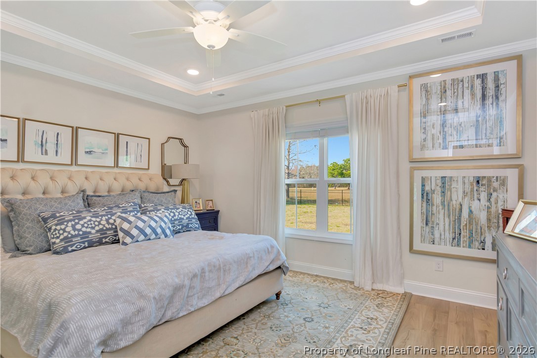 570 Old Tower Road Lumberton, NC 28360 - Photo 18 of 32 a bedroom with a large bed and a window