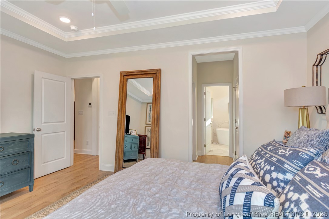 570 Old Tower Road Lumberton, NC 28360 - Photo 19 of 32 a bedroom with a bed and a lamp