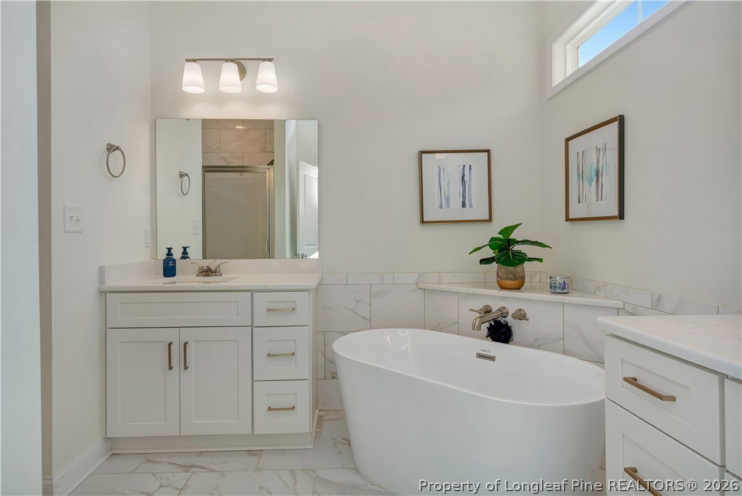 570 Old Tower Road Lumberton, NC 28360 - Photo 20 of 32 a bathroom with a sink and a bathtub