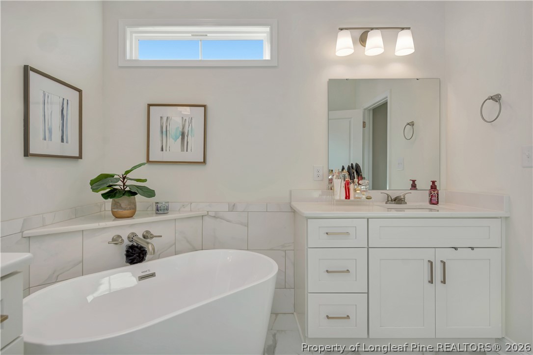 570 Old Tower Road Lumberton, NC 28360 - Photo 21 of 32 a bathroom with a sink and a mirror