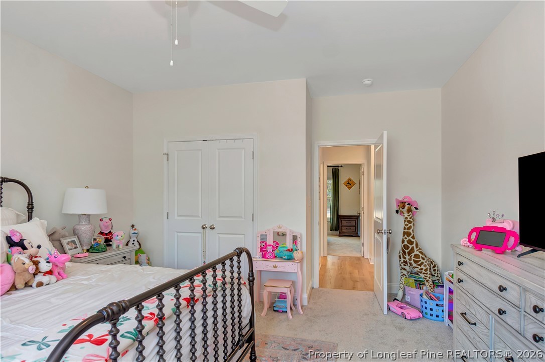 570 Old Tower Road Lumberton, NC 28360 - Photo 24 of 32 a bedroom with furniture a baby crib and a couch