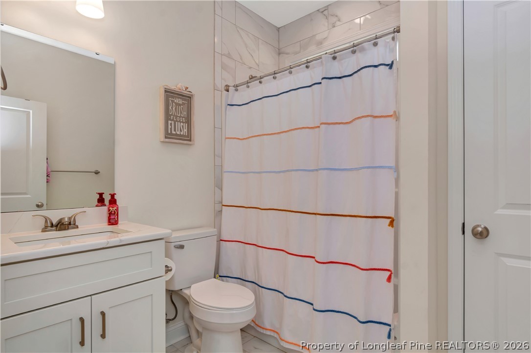 570 Old Tower Road Lumberton, NC 28360 - Photo 25 of 32 a bathroom with a sink toilet and shower