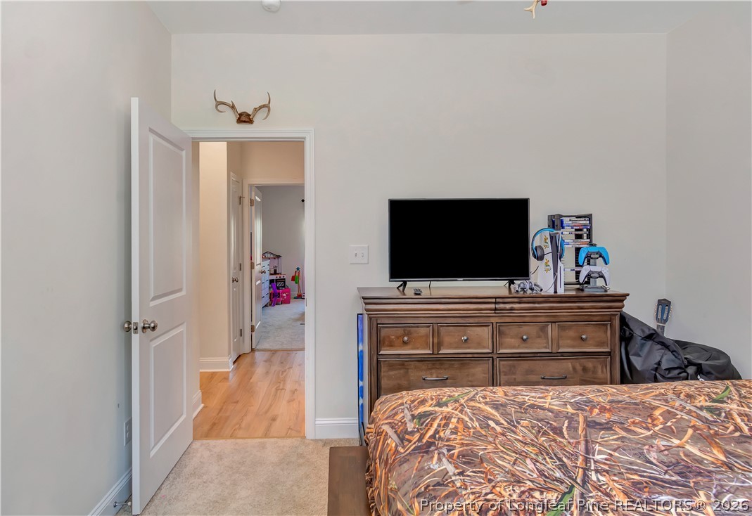 570 Old Tower Road Lumberton, NC 28360 - Photo 26 of 32 a view of living room with wooden floor and flat screen tv