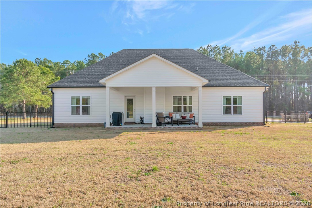 570 Old Tower Road Lumberton, NC 28360 - Photo 29 of 32 a front view of a house with a yard and garage