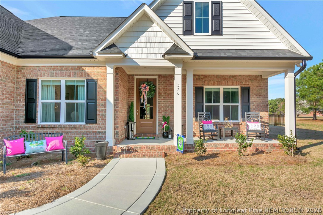 570 Old Tower Road Lumberton, NC 28360 - Photo 3 of 32 a view of a house with sitting area and garden