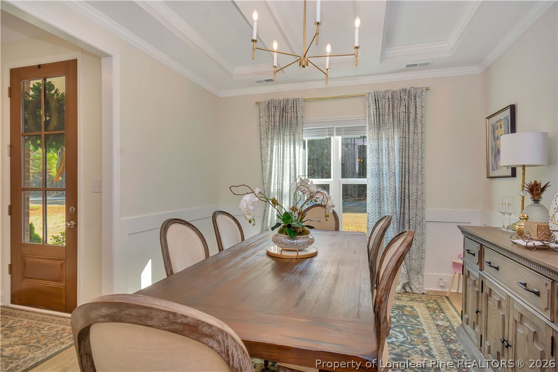 570 Old Tower Road Lumberton, NC 28360 - Photo 7 of 32 a view of a dining room with furniture window and wooden floor