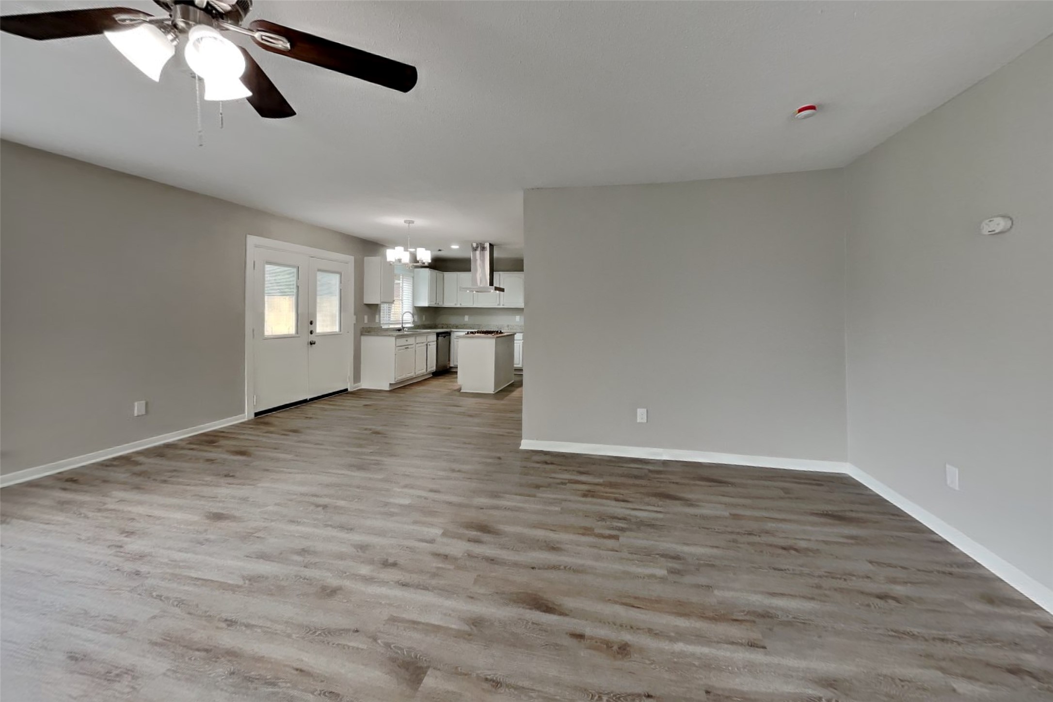 16303 Hickory Point Road Houston, TX 77095 - Photo 4 of 21 a view of empty room with wooden floor
