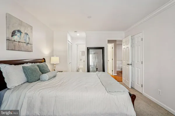 a large bed in a white room