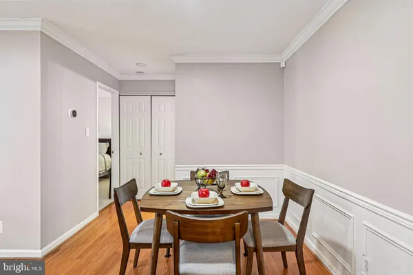 a view of a dining room with furniture and wooden floor