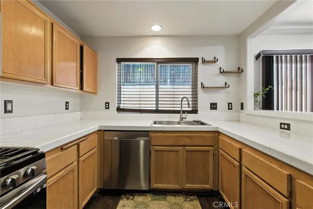 a kitchen with a sink stove and cabinets