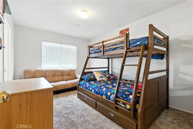 a bed room with furniture and a window