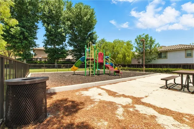 a view of a playground with basketball court