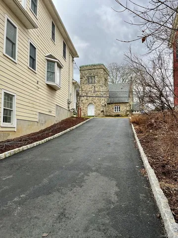 a view of a house with a street