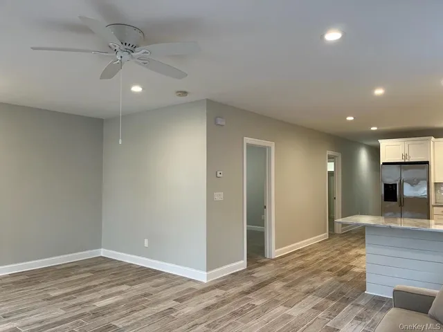 a kitchen with stainless steel appliances granite countertop a stove sink and cabinets