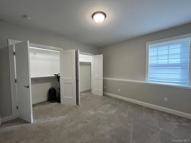 a large kitchen with stainless steel appliances granite countertop a stove a sink and a microwave