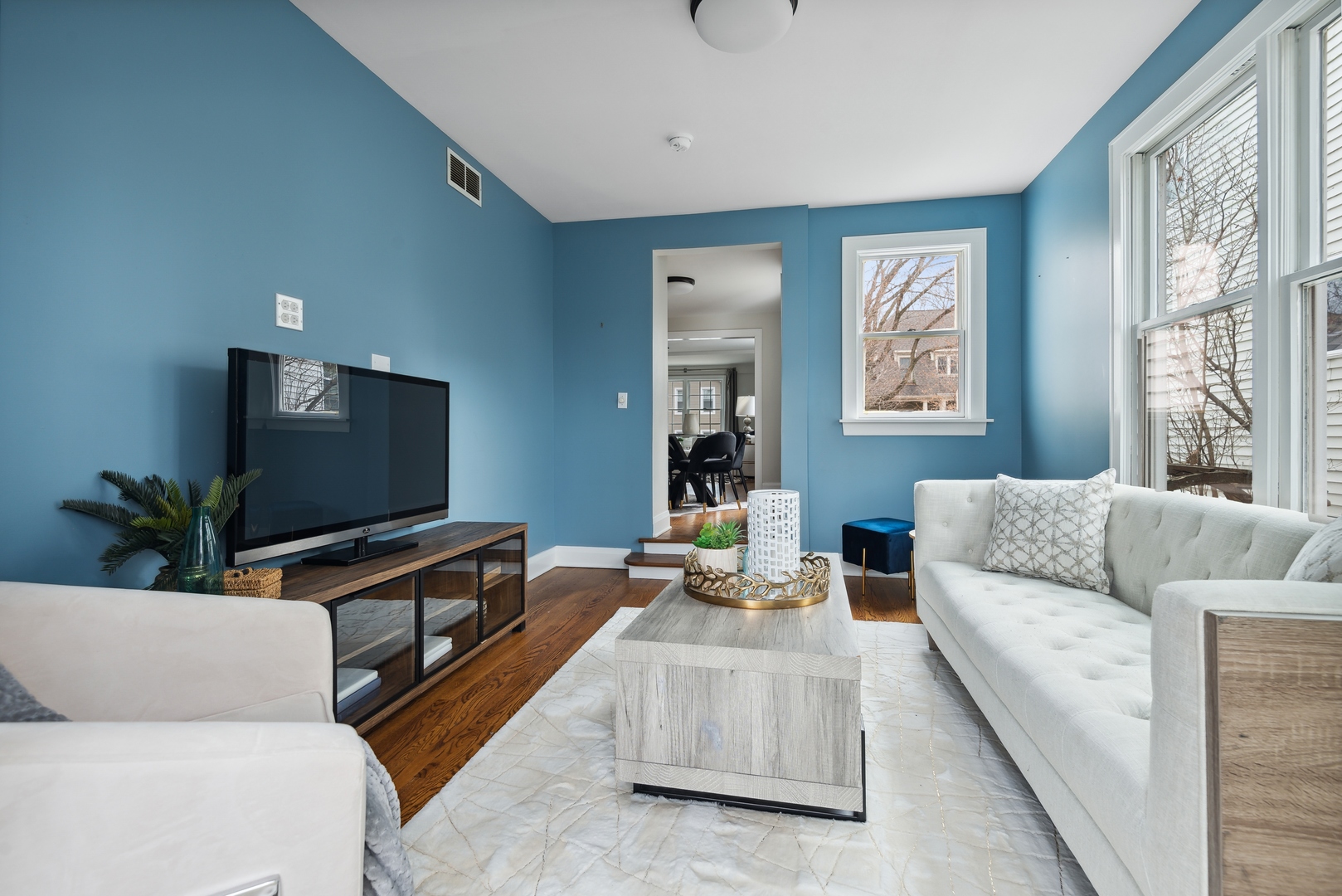 2120 Wesley Avenue Evanston, IL 60201 - Photo 14 of 32 a living room with furniture and a flat screen tv