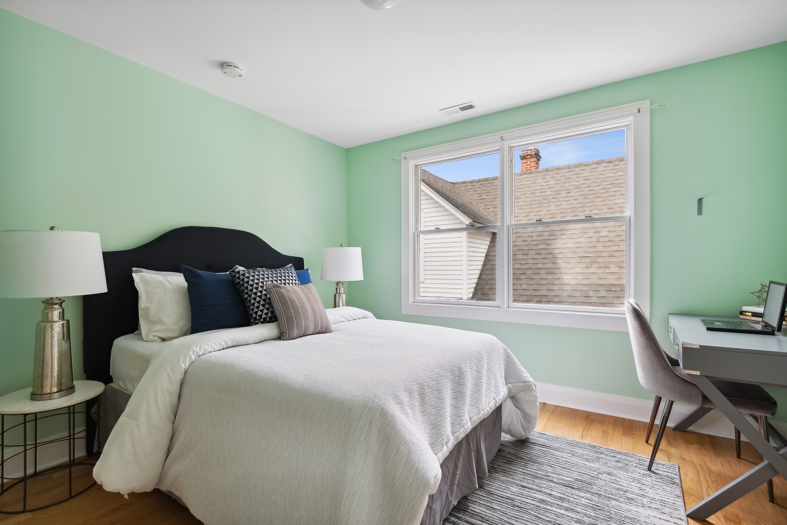2120 Wesley Avenue Evanston, IL 60201 - Photo 20 of 32 a bedroom with a bed and a table