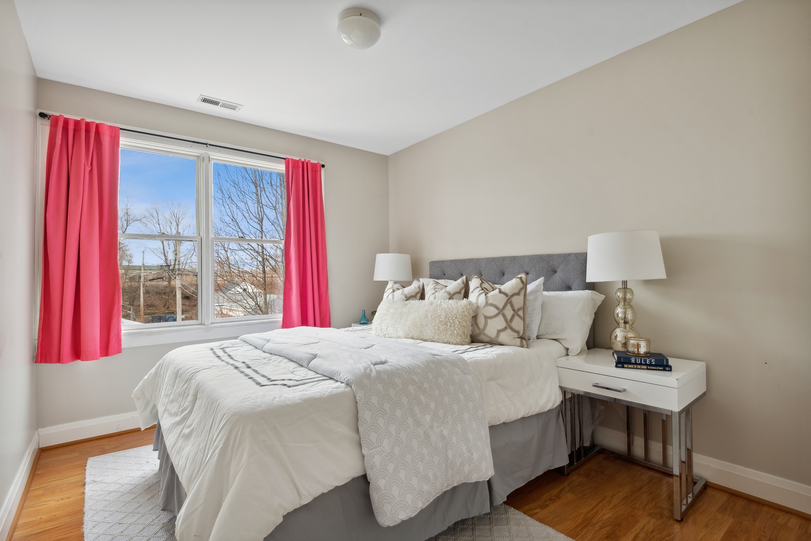2120 Wesley Avenue Evanston, IL 60201 - Photo 21 of 32 a bedroom with a bed and wooden floor