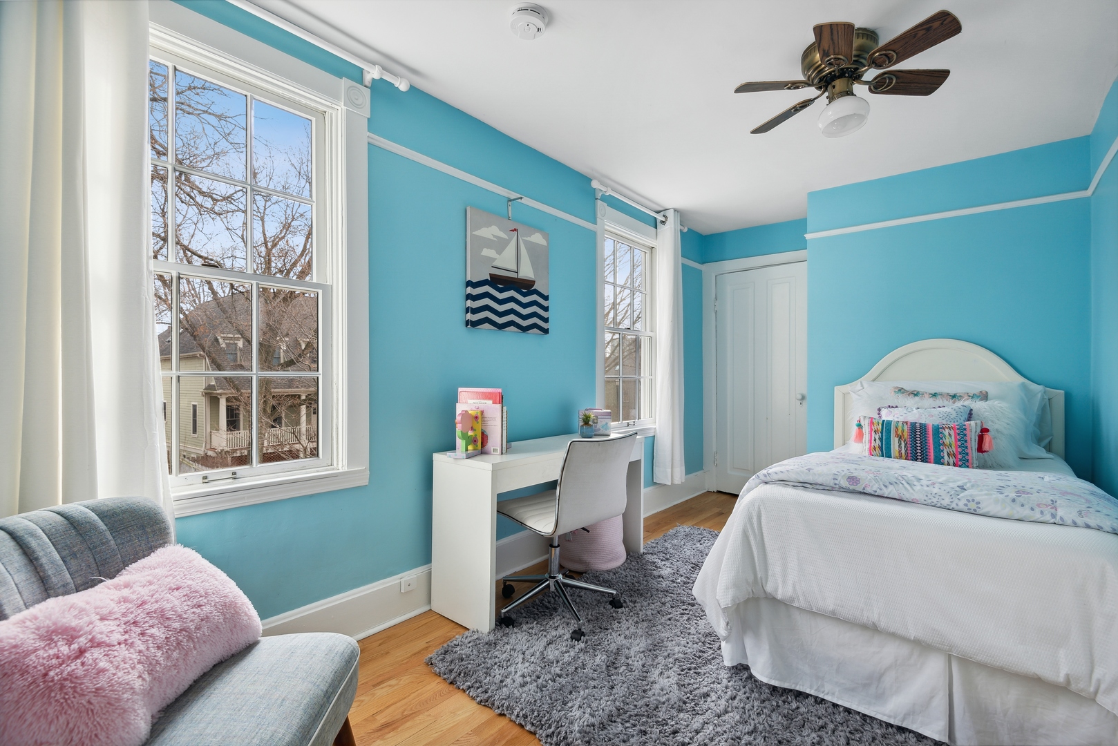 2120 Wesley Avenue Evanston, IL 60201 - Photo 22 of 32 a bedroom with a bed and a window