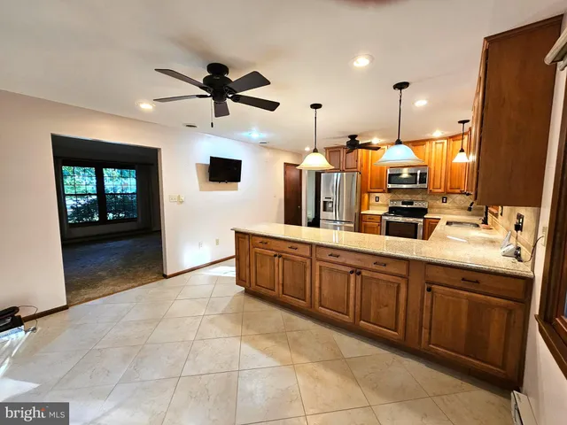 a large bathroom with a large tub and sink