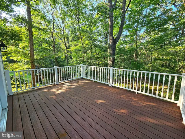a view of deck with wooden floor and fence