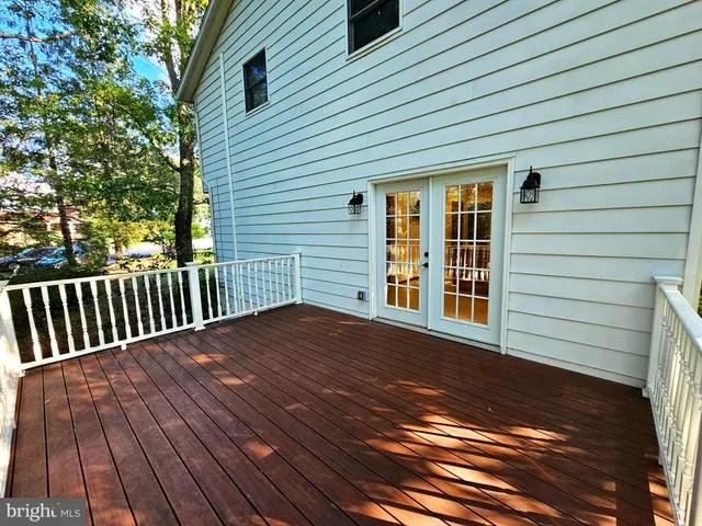 a view of backyard with wooden deck