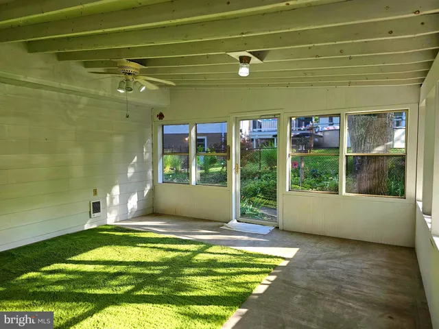 a spacious bedroom with a large window