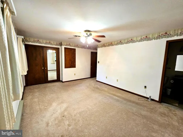 a bathroom with a shower and toilet