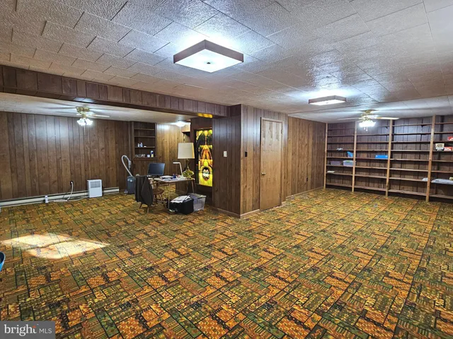 a view of a livingroom with furniture and chandelier