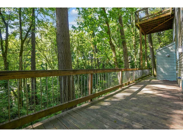 a view of balcony with yard