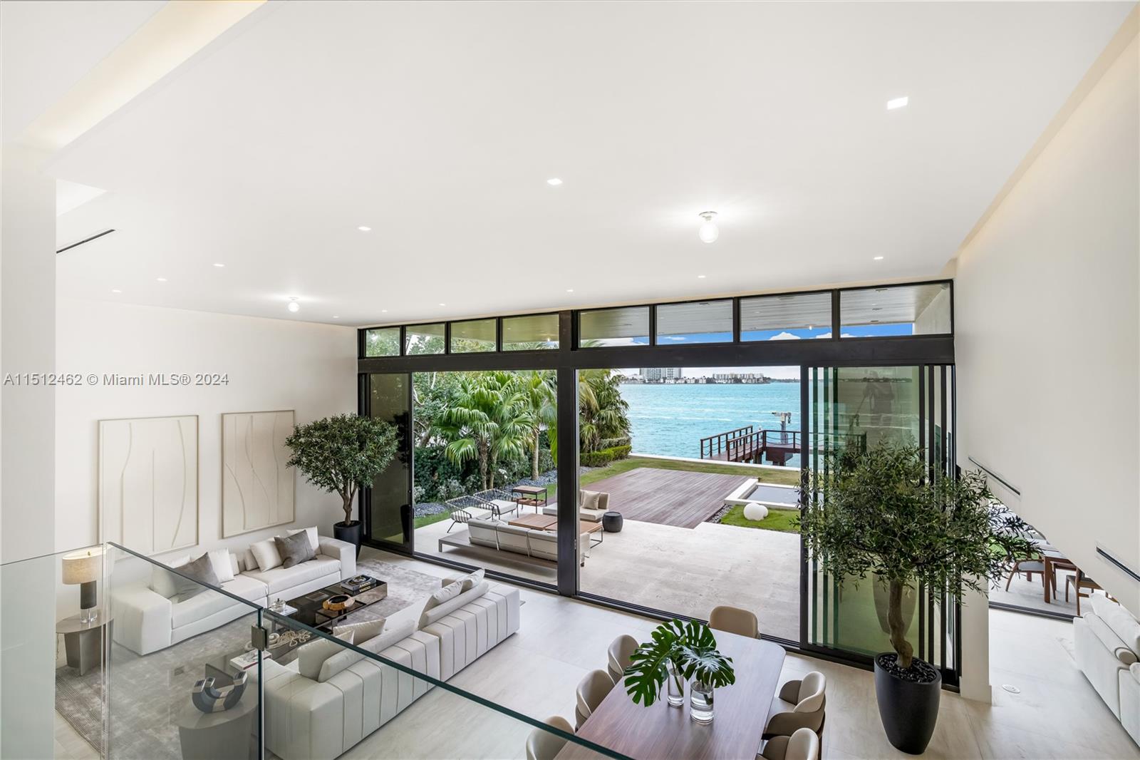 Normandy Shores Miami Beach, FL 33141 - Photo 23 of 47 a living room with furniture and a floor to ceiling window
