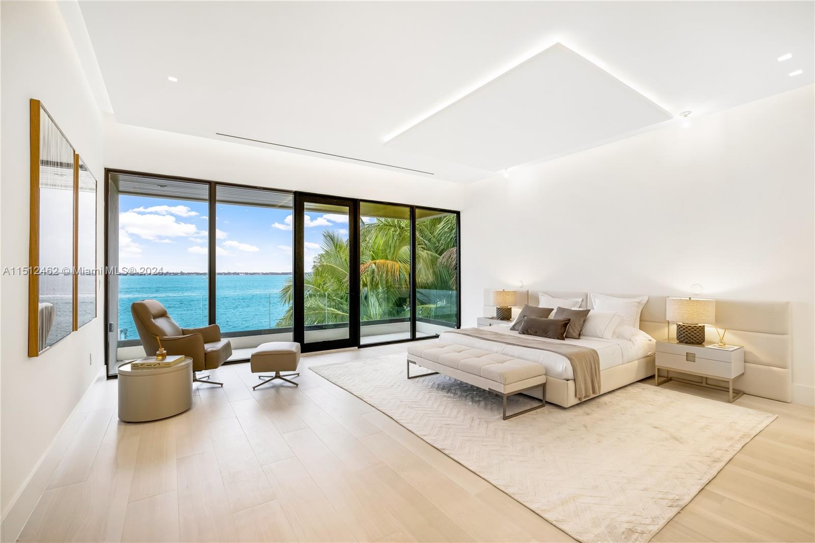 Normandy Shores Miami Beach, FL 33141 - Photo 34 of 47 a spacious bedroom with a bed and large glass window