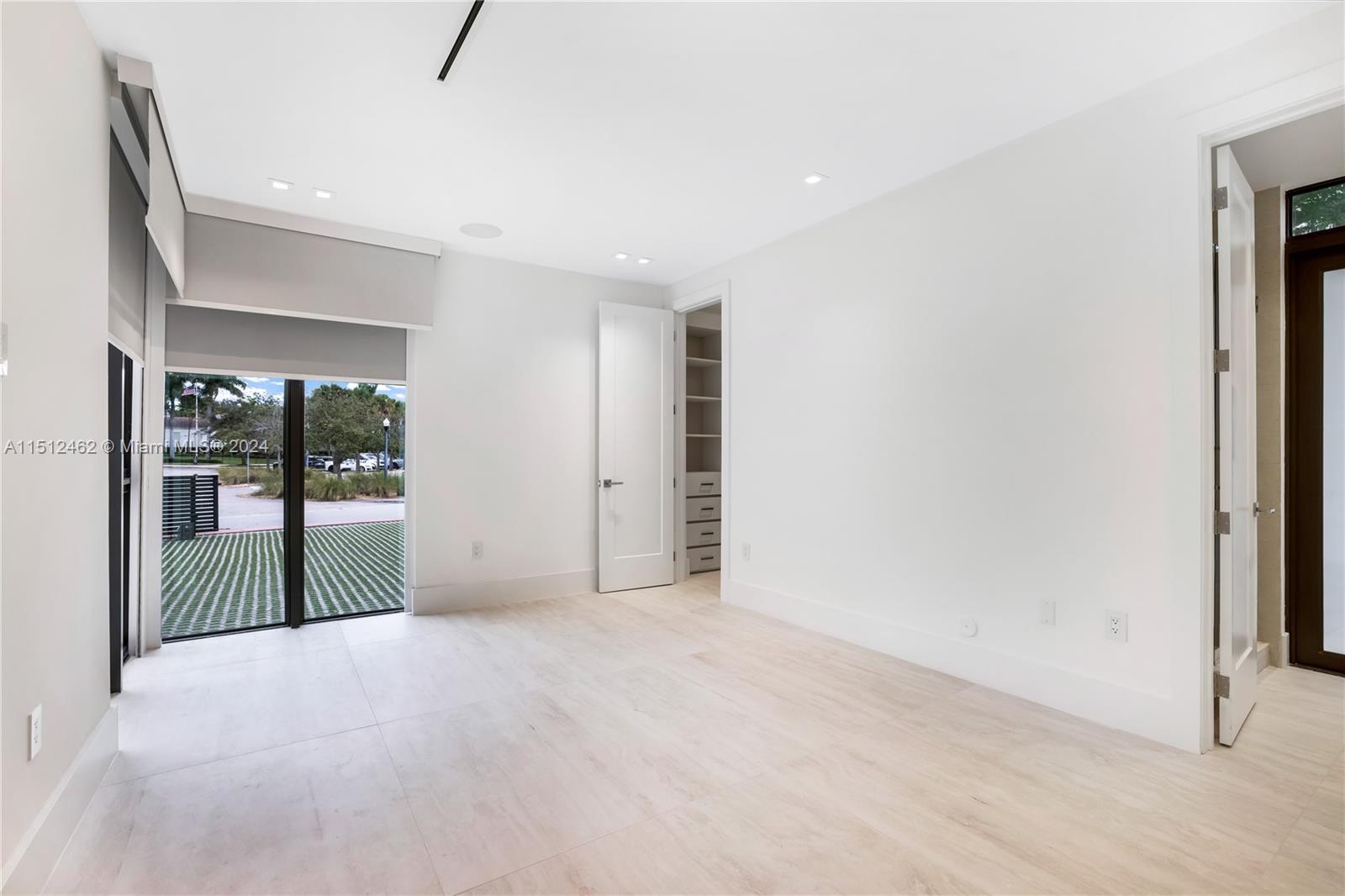 Normandy Shores Miami Beach, FL 33141 - Photo 44 of 47 an empty room with sliding door and balcony