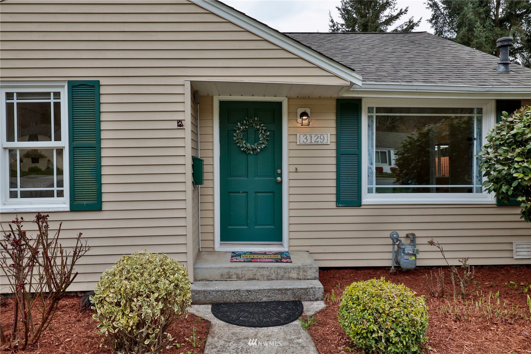 3129 Southeast 5th Street Renton, WA 98058 - Photo 1 of 27 a view of a house with a yard