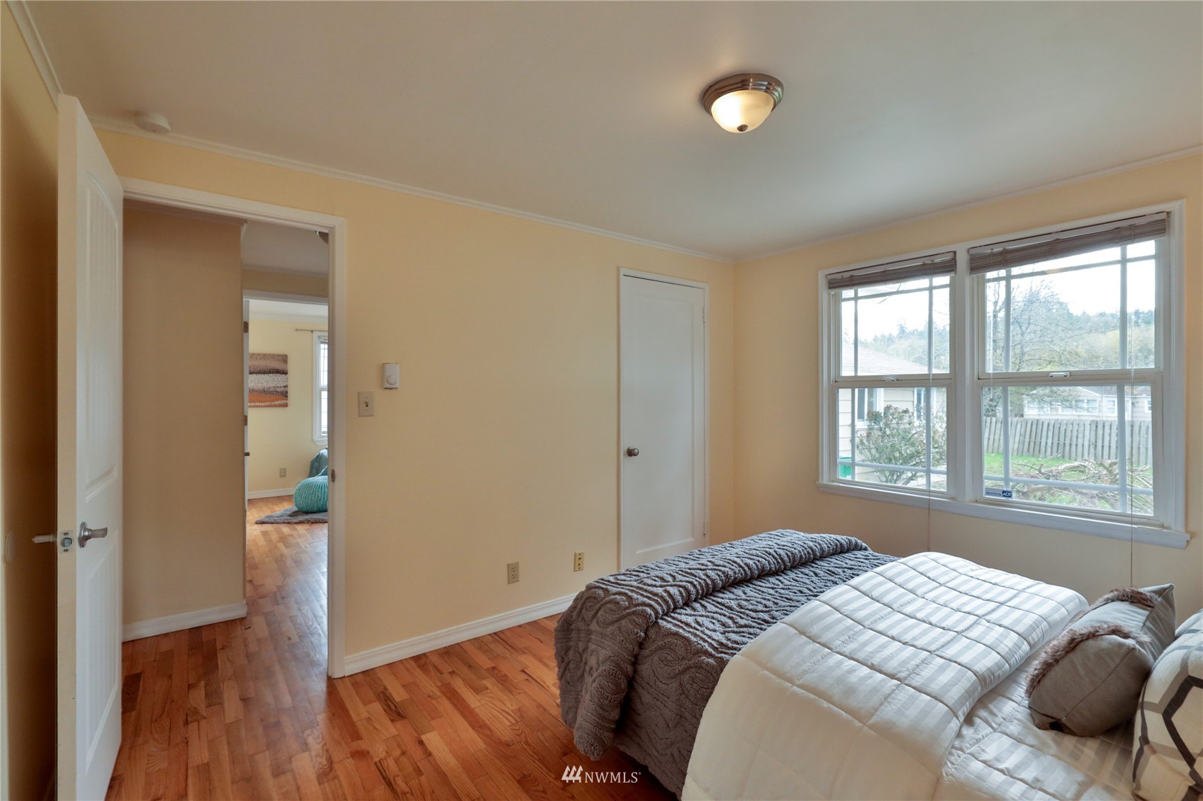 3129 Southeast 5th Street Renton, WA 98058 - Photo 12 of 27 a bedroom with a bed and a window
