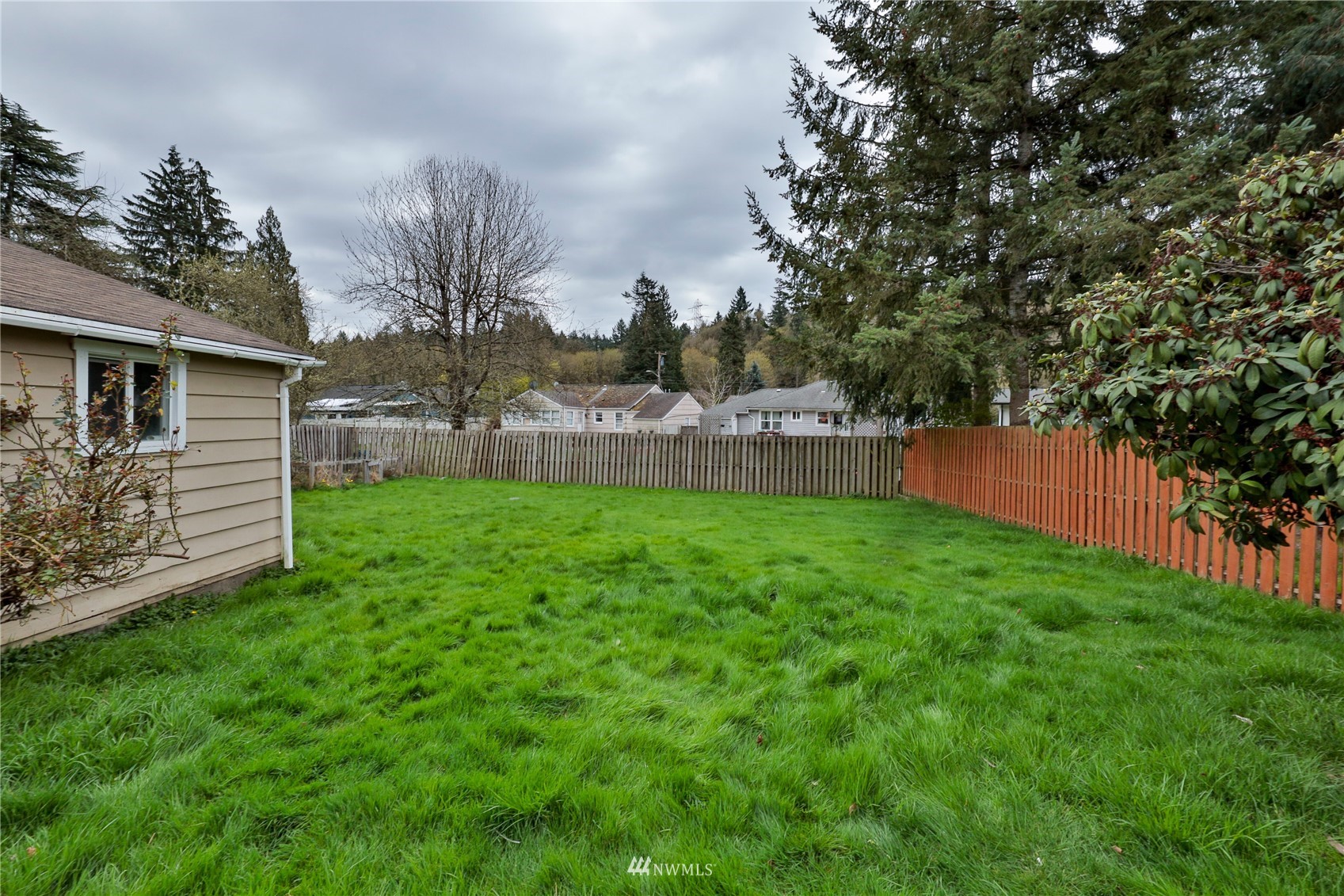 3129 Southeast 5th Street Renton, WA 98058 - Photo 15 of 27 a view of a backyard with a small cabin