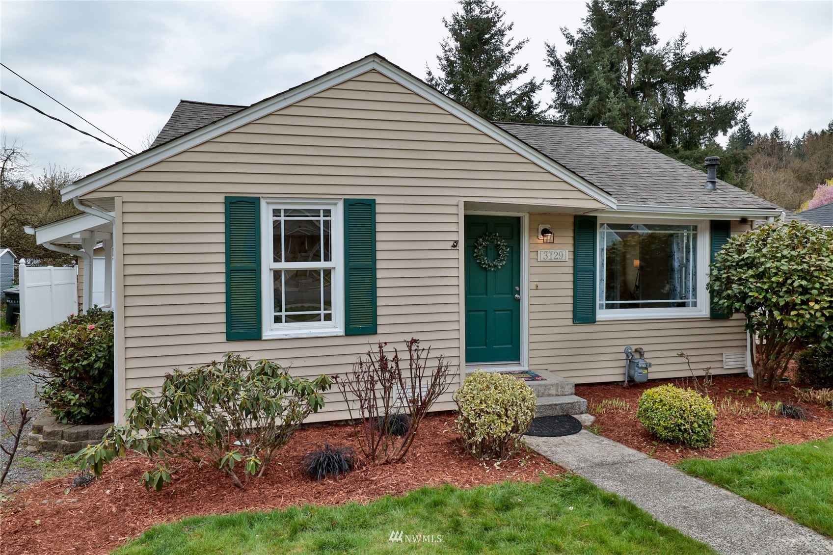 3129 Southeast 5th Street Renton, WA 98058 - Photo 20 of 27 a front view of a house with a yard
