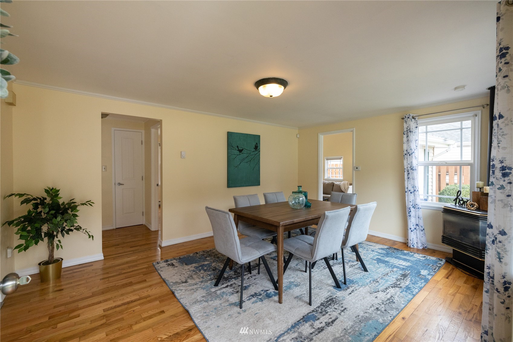 3129 Southeast 5th Street Renton, WA 98058 - Photo 4 of 27 a view of a dining room with furniture window and wooden floor