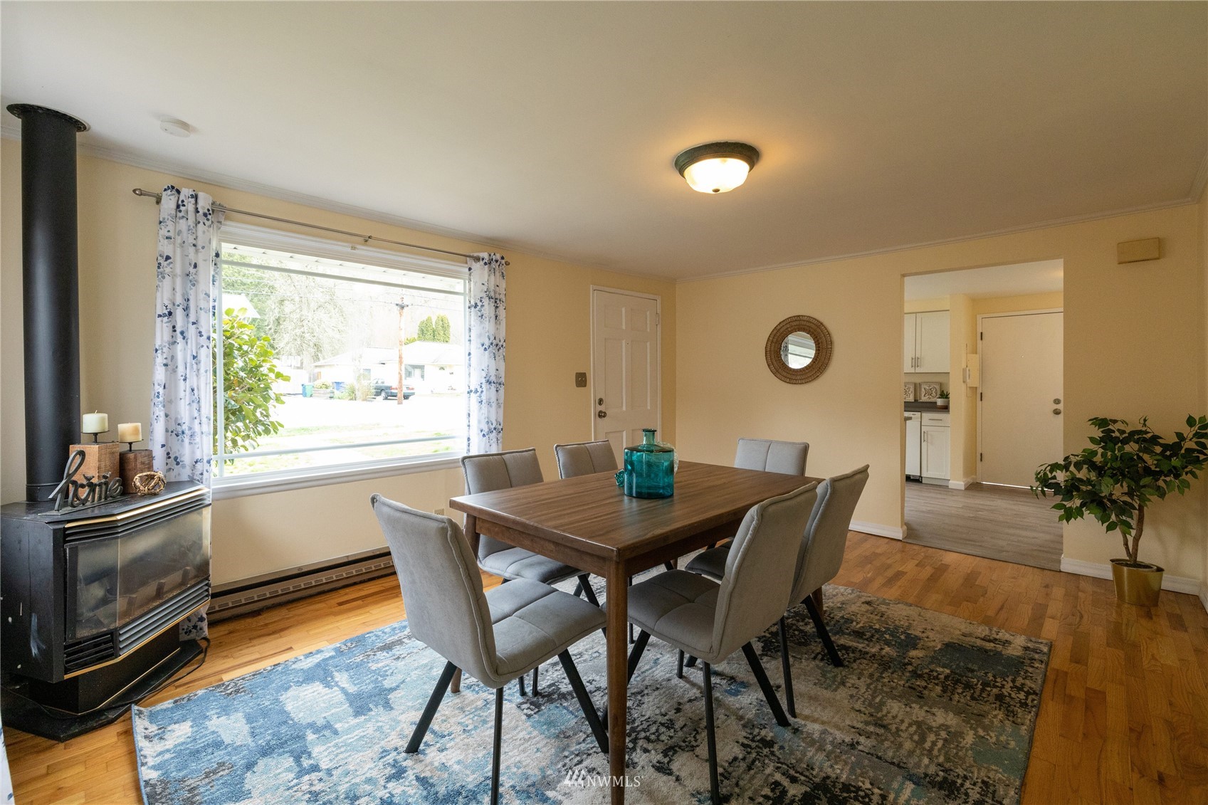3129 Southeast 5th Street Renton, WA 98058 - Photo 5 of 27 a view of a dining room with furniture window and wooden floor