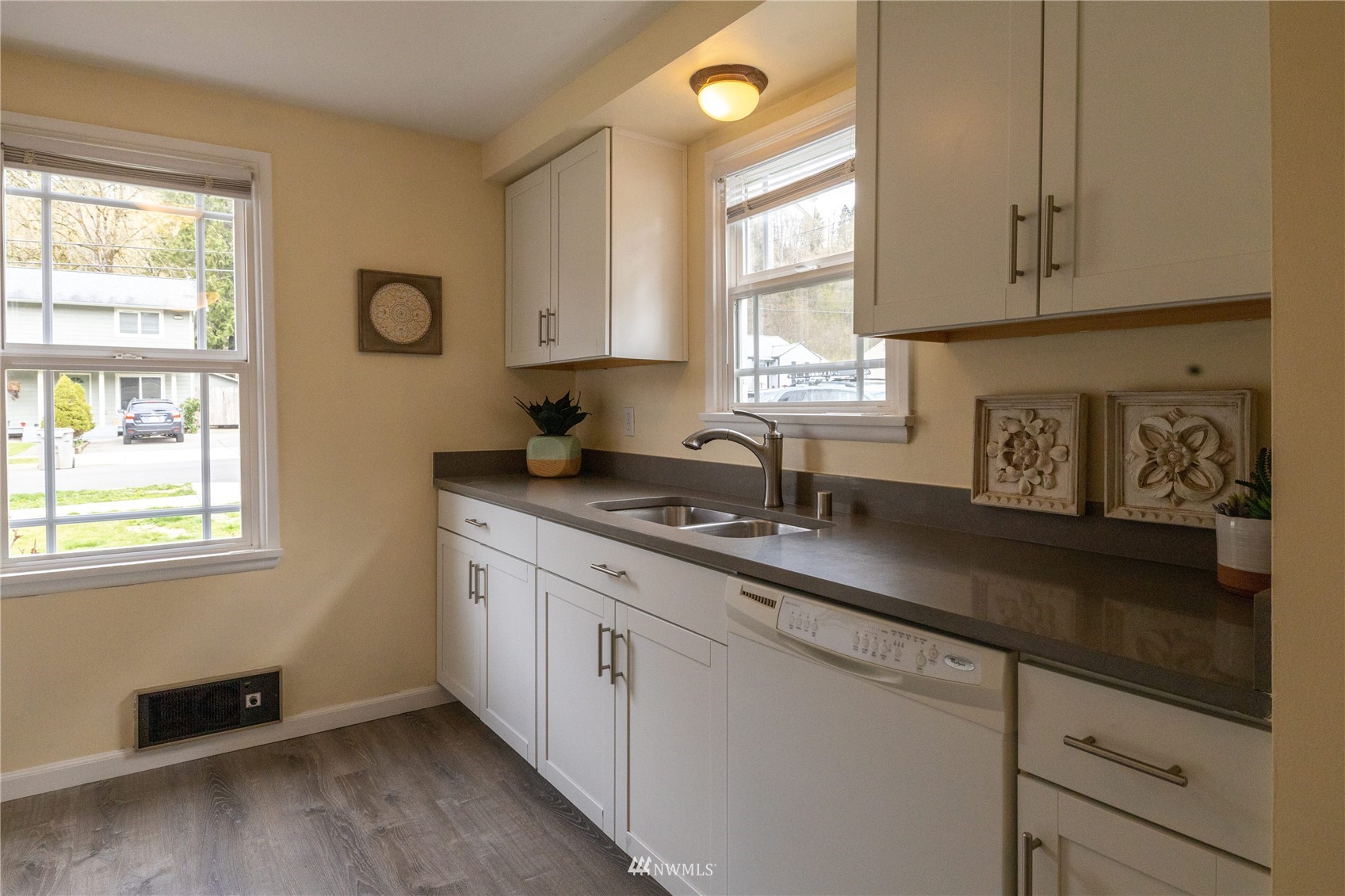 3129 Southeast 5th Street Renton, WA 98058 - Photo 8 of 27 a kitchen with granite countertop white cabinets and window