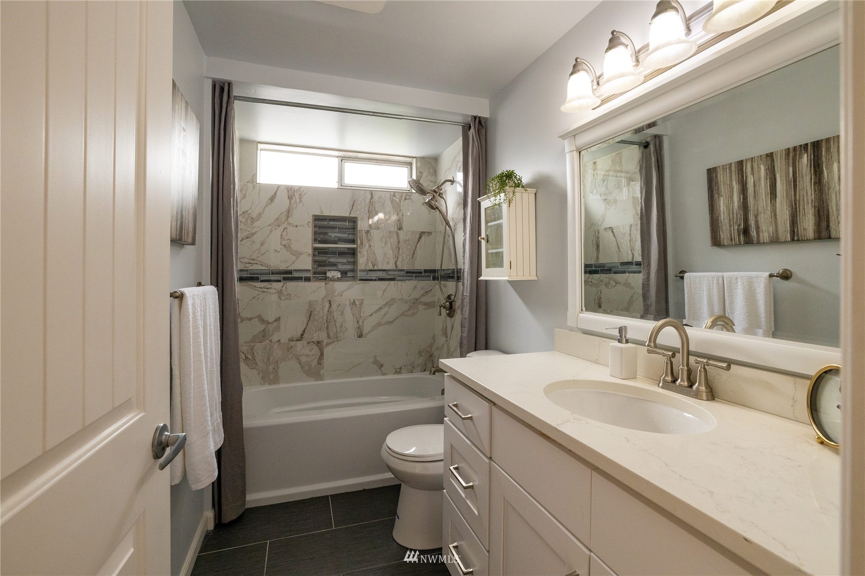 3129 Southeast 5th Street Renton, WA 98058 - Photo 9 of 27 a bathroom with a sink a toilet and shower