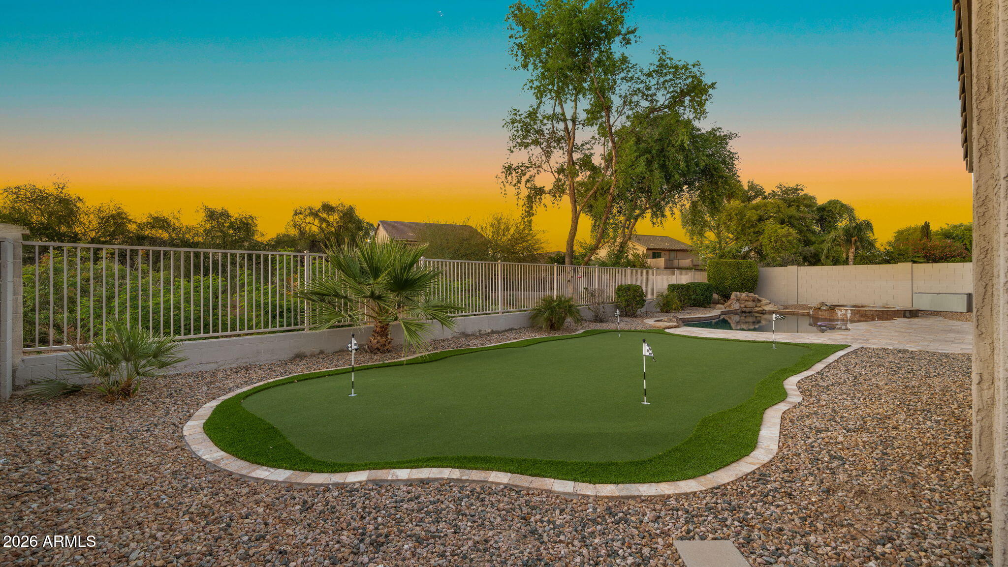 3344 East Hopkins Road Gilbert, AZ 85295 - Photo 26 of 32 a view of a swimming pool in the back